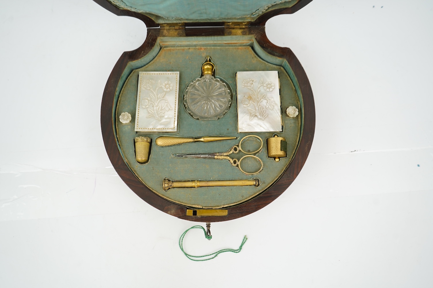 An early Victorian rosewood and mother of pearl inlaid sewing box